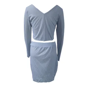Light blue ribbed knit long sleeve crop top and matching mini skirt detail showcase.