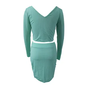 Mint green ribbed long sleeve crop top and matching mini skirt two piece set detail view.