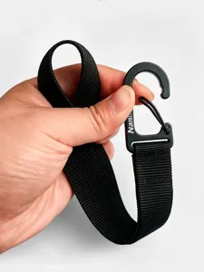Detailed view of black multi-purpose stroller hook and durable nylon strap for easy hanging.