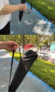 Outdoor black storage bag strap detail showing portable carrying method for trekking poles