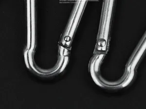 Stainless steel spring snap hook miniature carabiner clip for outdoor hiking gear hardware.