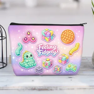 Detail of a canvas makeup bag with colorful fidget toy illustrations and zipper closure.
