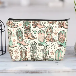 Detail of canvas makeup bag featuring vintage colorful cowboy boot patterns