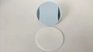 Detailed close-up view of round silicone door handle pull with white adhesive base