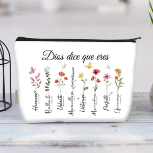 Durable floral canvas cosmetic bag with Spanish inspirational text and zipper detail
