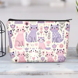 Detailed close-up of a canvas cosmetic pouch with cute pink and purple cat cartoon patterns