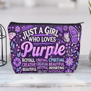 Detail of purple canvas makeup bag with butterfly pattern and girl-themed quote.