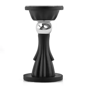 Detailed view of the creative human-shaped magnetic door stopper in black and silver.