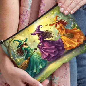 Detail shot of a canvas cosmetic pouch featuring a vibrant whimsical witches print