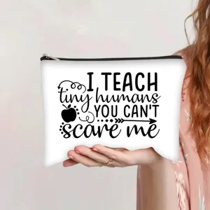 Close-up of white canvas makeup bag with I TEACH tiny humans print