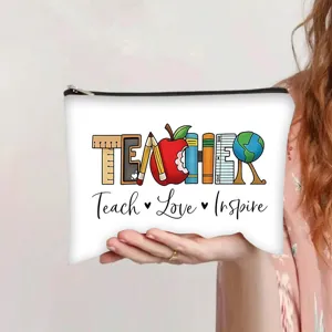 Detail view of a white canvas makeup bag featuring Teacher Teach Love Inspire print