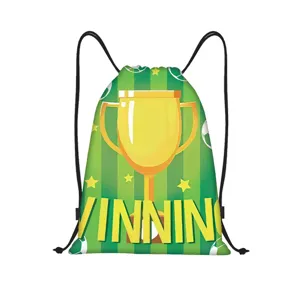 Durable green football drawstring backpack featuring golden trophy and WINNING sports design.
