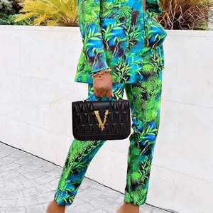 Stylish tropical palm leaf print casual suit two-piece set, featuring blazer and pants for women.