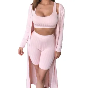 Pink ribbed three piece lounge set detail showing soft fabric texture and cardigan.