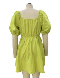 Detail view of green square neck puff sleeve dress back showcasing waist cinching design.