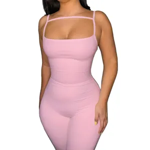 Pink ribbed strappy jumpsuit detail showing slim fit, sexy styling and soft textured fabric.