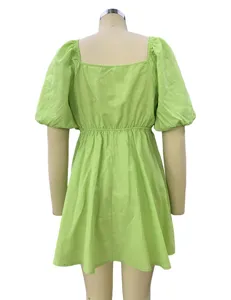 Back detail of lime green square neck puff sleeve mini dress, showing relaxed fit style.