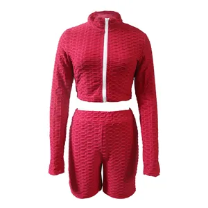 Detailed view of the red honeycomb long sleeve crop top and shorts activewear fitness set.