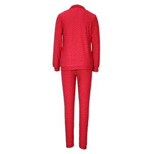 Red honeycomb textured long sleeve top and pants tracksuit set for women activewear.