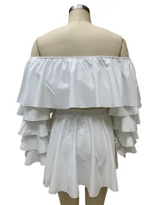 White off-shoulder ruffled top and mini skirt two-piece set, back detail view, clean design.