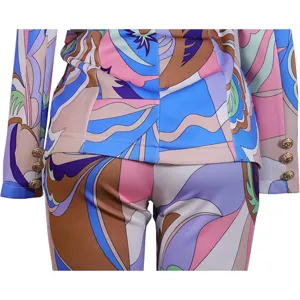 Detailed view of women fashion two piece pantsuit blazer set with colorful abstract print.