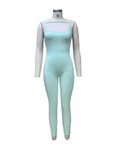 Detailed view of a light green ribbed cami jumpsuit, slim fit texture, minimalist style.