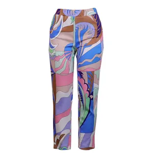 Stylish women's abstract geometric printed casual trousers, vibrant pattern long pants.