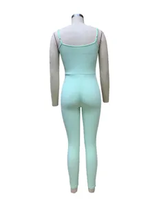Ribbed camisole jumpsuit detail view, soft mint green fabric, slim fit design for summer.