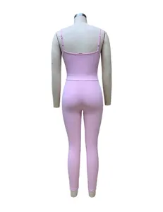 Detailed back view of the pink ribbed camisole jumpsuit, showing slim fit and texture.