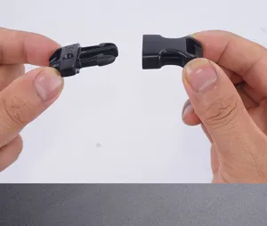 Close-up detail of 15mm black plastic side release buckle for paracord bracelets DIY accessories.