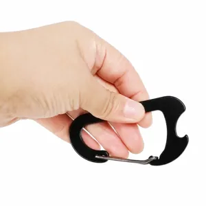 Detail shot of the black aluminum carabiner with wire spring gate and built-in bottle opener.