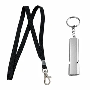Detail view of the metal survival whistle with black lanyard and key ring for outdoor emergency.