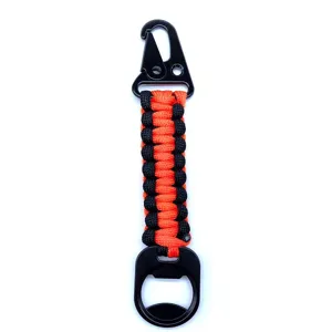 Paracord keychain with eagle hook and bottle opener, black and orange woven detail view.