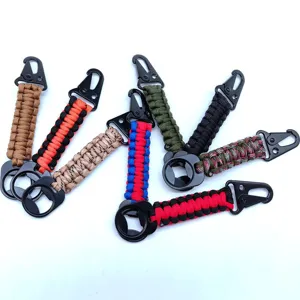 Close-up detail of outdoor paracord keychain with bottle opener and hook, assorted colors.