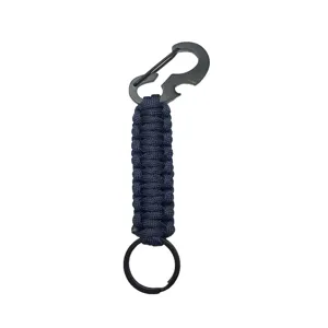 Close up detail view of black paracord keychain featuring metal carabiner and bottle opener.