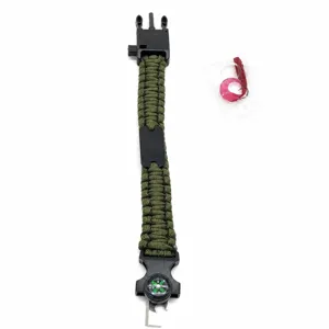Outdoor survival paracord bracelet with compass, blade, and fishing hook accessories.