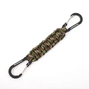 Outdoor paracord keychain detail, braided camo rope with dual black metal carabiners hook.