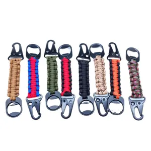 Outdoor survival paracord keychain with durable metal carabiner and bottle opener.