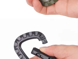 Detail shot of a black plastic D-ring carabiner, durable tactical hook for outdoor camping.