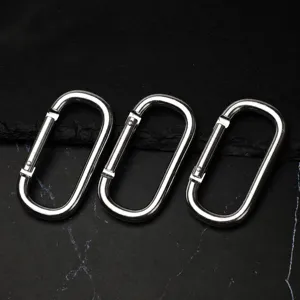 Detail view of three oval aluminum alloy carabiners snap hooks, durable gear for outdoor use.