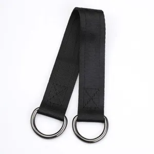 Close-up of black swing hanging strap with sturdy metal D-rings for outdoor sports equipment.
