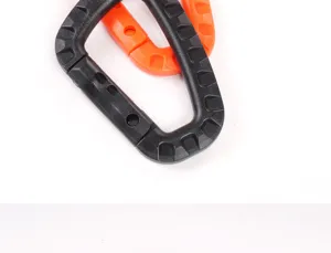 Plastic D-ring carabiner snap hook detail shot, outdoor tactical camping gear close up.