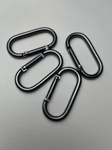 Close-up detail shot of gunmetal oval carabiner spring hooks, durable aluminum construction.