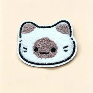 Close-up of cute plush cat head hair pad patch accessory