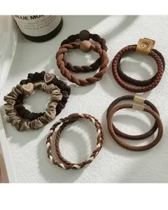 Detailed view of assorted elastic hair ties in earthy tones like brown and beige