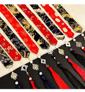 Detailed close-up of traditional Chinese Hanfu hair ribbons with tassels and motifs