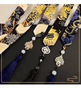 Detailed view of Chinese style Hanfu hair ribbons with tassels and traditional crane patterns