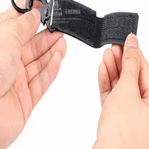 Tactical webbing keychain with carabiner and hook, ideal for outdoor backpack attachment.
