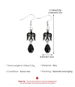 Detailed view of ethnic Kazakh alloy drop earrings with black teardrop beads and dimensions