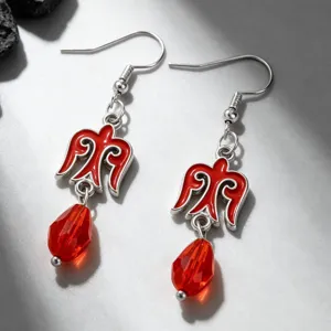 Detailed view of Kazakh style red ethnic earrings featuring bird motif and faceted beads